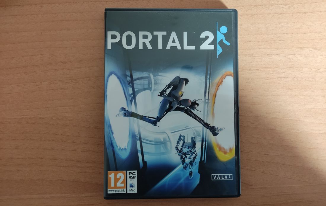 Carátula de Portal 2 con el soporte para Mac indicado